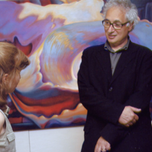 Renowned painter and printmakerTerry Winters shown here with paula Crawford, views her thesis exhibit at RIT.